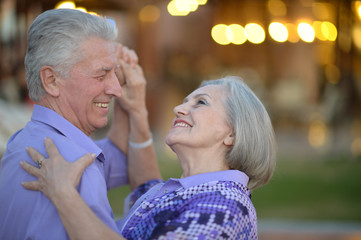 Senior couple dancing at evening