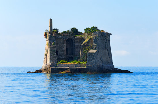 Scola Tower - Gulf of La Spezia Italy / The Scola Tower (Torre Scola) XVII century in the Gulf of La Spezia or Gulf of poets (Golfo dei poeti). La Spezia, Liguria, Italy