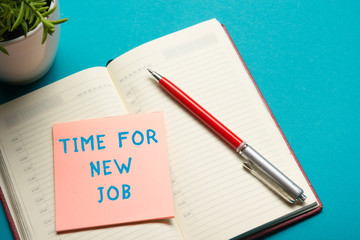 Job interview concept . Office table top view. Notepad, pen and reminder with word