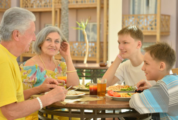 Grandparents with grandchildren at breakfast