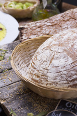 Round ( homemade ) bread over rustic background
