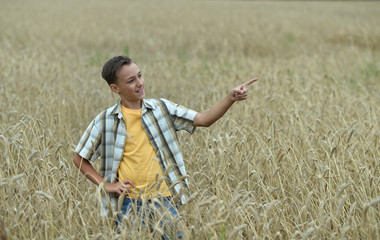 happy Boy in field pointing