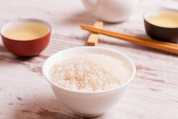 rice, green tea and chopsticks for sushi