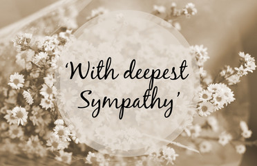 "With deepest sympathy" note on small flower sepia tone