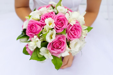 Beautiful wedding bouquet of flowers in bride’s hands