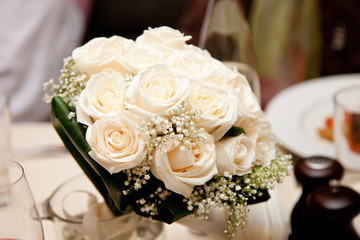 Beautiful wedding bouquet on restaurant table