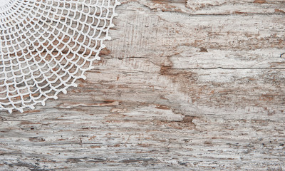 Lace fabric on the old wood