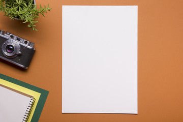 Tourism, travel concept. Office desk table with notepad, camera and supplies. Top view. Copy space for text.