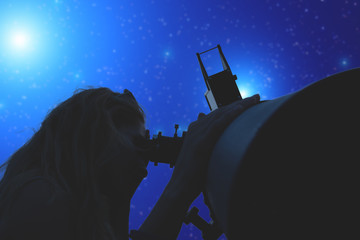 Stargazing through a telescope. 