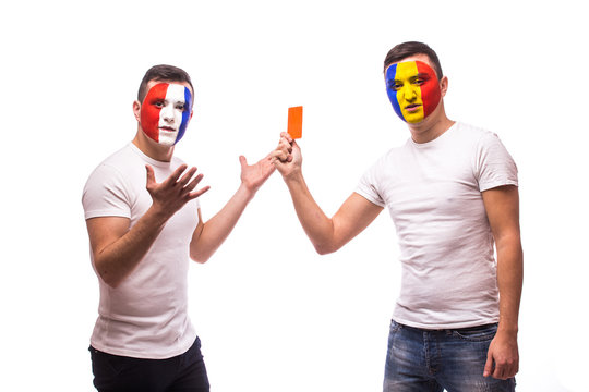 France vs Romania. Football fan of  Romania national teams show red card to France fan on white background.  European  football fans concept.