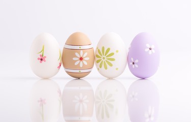 Easter eggs painted in pastel colors on white background