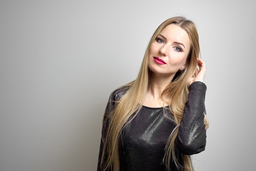 Fototapeta premium Fashion model with bright makeup. Portrait of young fashion woman with long blond hair