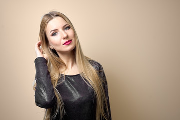 Fototapeta premium Fashion model with bright makeup. Portrait of young fashion woman with long blond hair