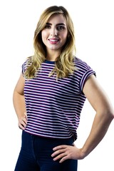 Fototapeta premium Smiling woman with hands on hips posing for camera
