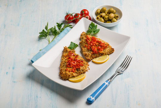 baked fish fillet with tomatoes and olives
