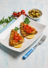 baked fish fillet with tomatoes and olives