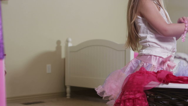 Little girl playing dressup