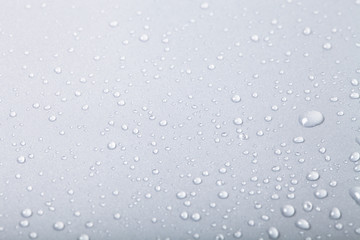 Drops of water on a color background. Gray. Shallow depth of fie