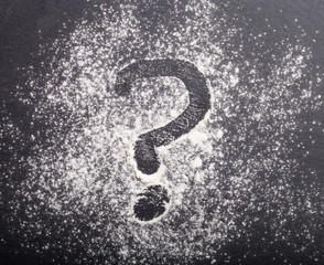 Flour spilling on color background of slate cutting board
