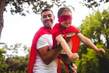 Father and daughter pretending to be a superhero 