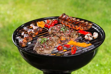 Zelfklevend Fotobehang Barbecue grill with various kinds of meat. © Lukas Gojda