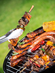 Barbecue grill with various kinds of meat.