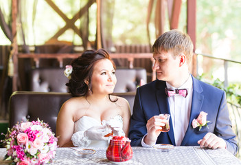 Groom and bride are drinking tea.