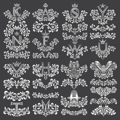 Big set of ornamental elements for design. White floral decorations on black. Isolated tattoo patterns in vintage style. Vintage page ornate decorations.