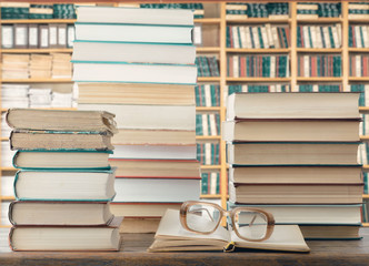 Fototapeta premium Books and eyeglasses In library