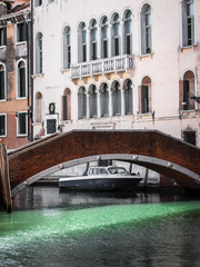 Fototapeta na wymiar Bridge in Venice, Italy and Historical Building Facade in Backgr