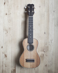 Obraz premium ukulele on wooden background. close up