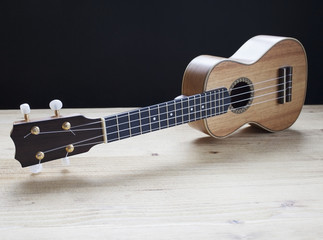 Obraz na płótnie Canvas ukulele on wooden background