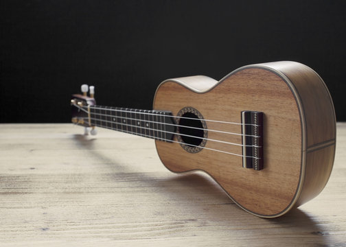 ukulele on wooden background