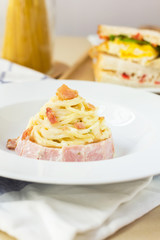 spaghetti carbonara on wood table,shallow Depth of Field,Focus on bacon.