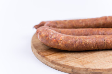 Raw sausages isolated on white