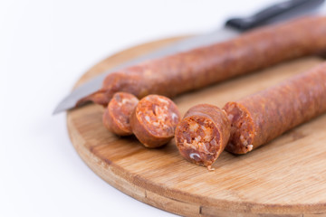 Sliced raw sausage on the cutting board