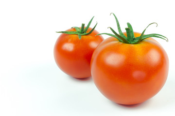 Tomatoes. Whole and a half isolated on white
