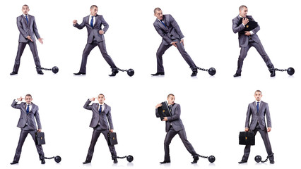 Businessman with shackles on white