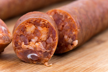 Macro view of homemade sausage isolated on white