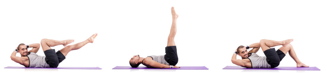 Obraz premium Man doing exercises on white