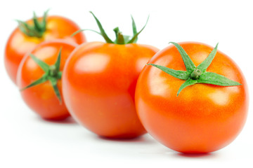 Tomatoes. Whole and a half isolated on white