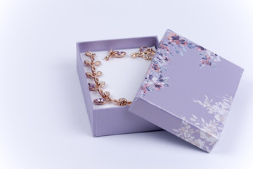 Beautiful necklace with earrings in a purple gift box