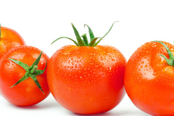 Tomatoes. Whole and a half isolated on white