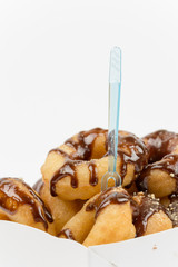 Close view of donuts with chocolate cream over white background