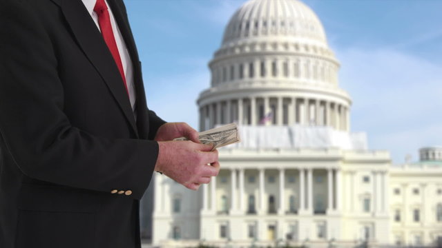 Politician counting money in front of US Capitol building