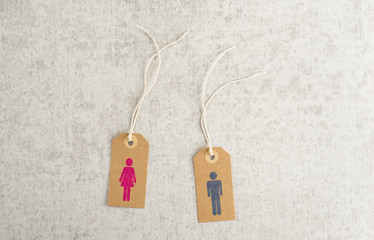 Paper tags with female and male symbol. Concept of gender, relationship and living together.