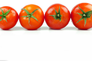 Tomatoes. Whole and a half isolated on white
