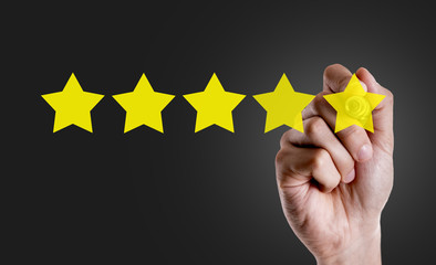 Hand writing the text: 5 Stars