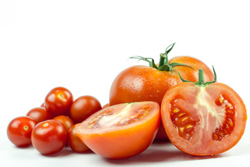 Tomatoes. Whole and a half isolated on white