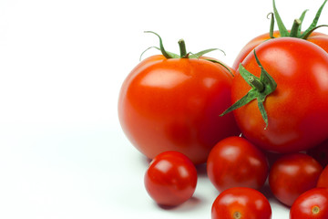 Tomatoes. Whole and a half isolated on white